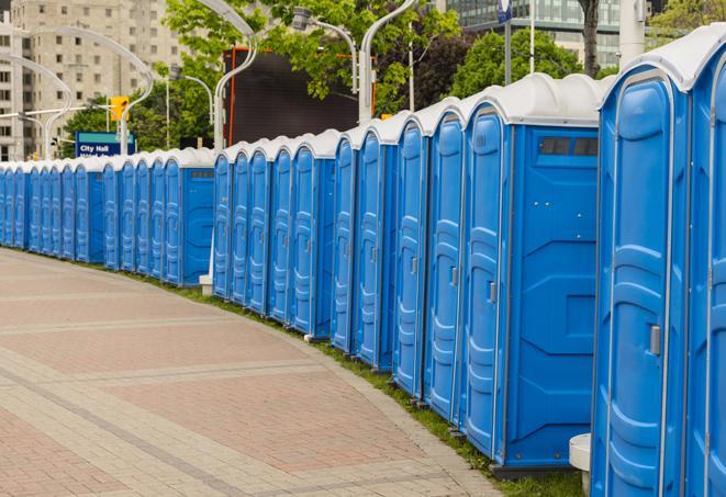 a line of portable restrooms at a sporting event, providing athletes and spectators with clean and accessible facilities in Northfield IL